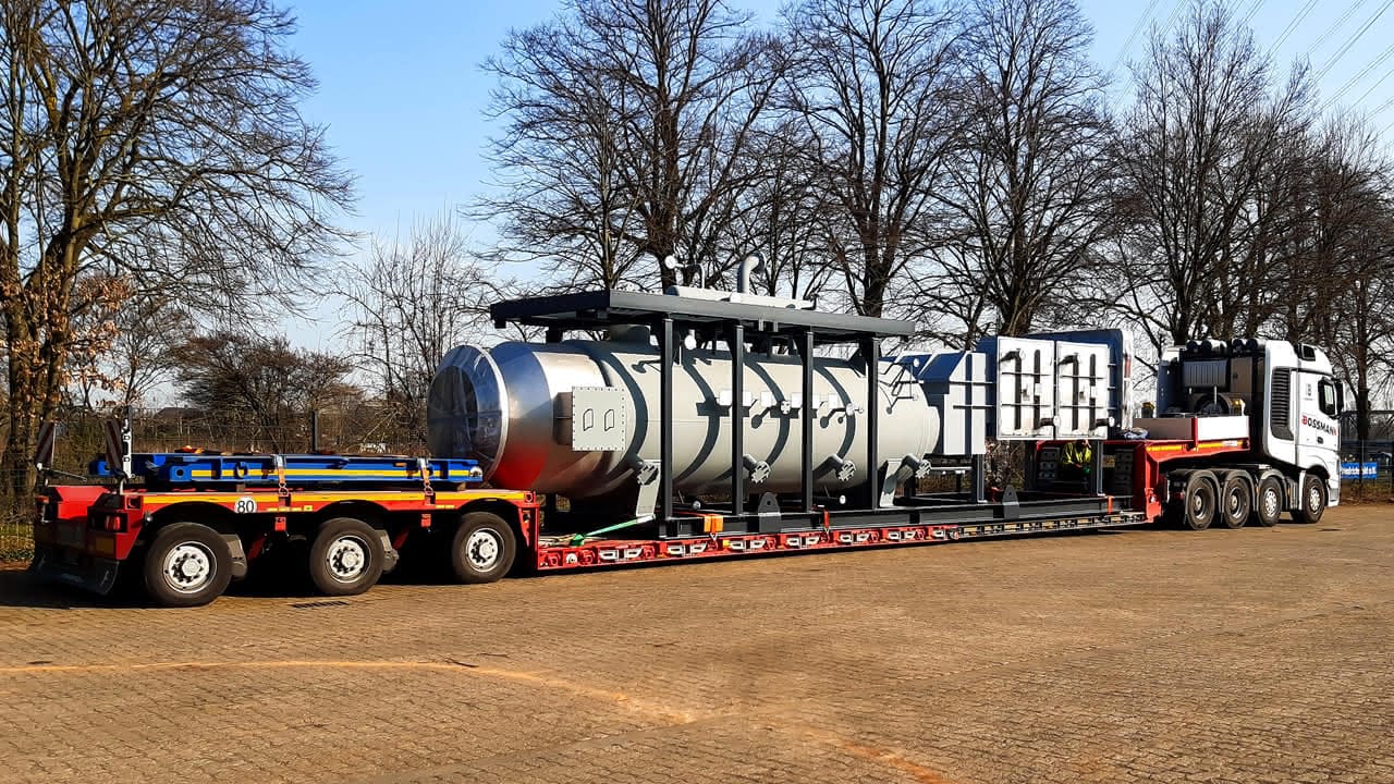 MAHLER process vessel loaded on a heavy-duty transport truck for overland delivery.