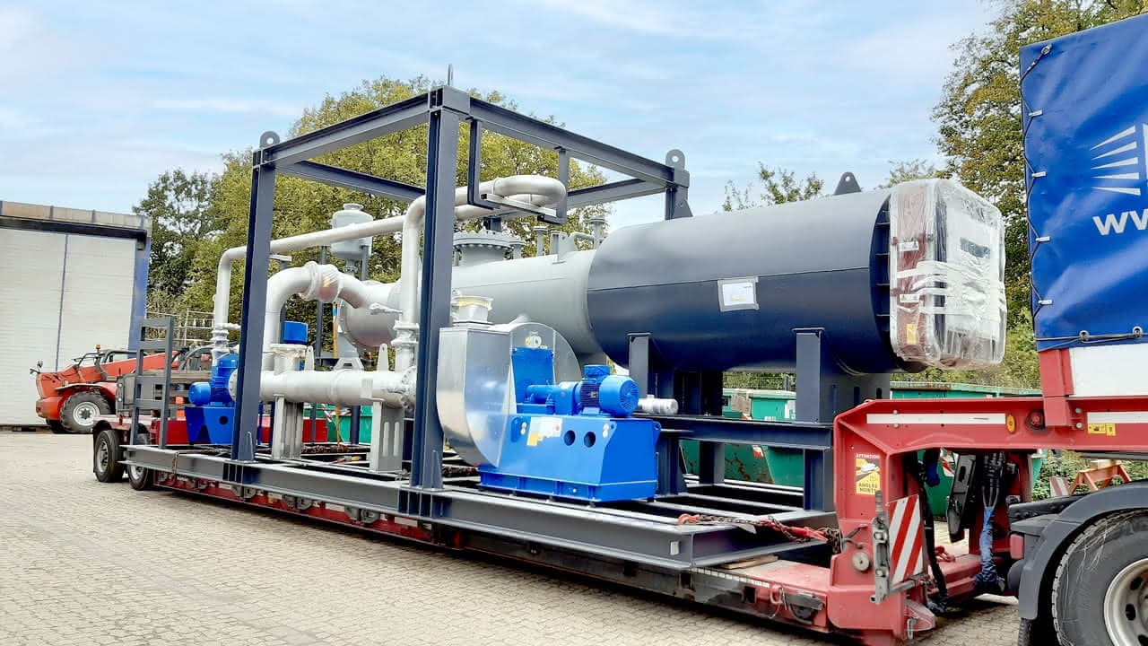 MAHLER skid-mounted process module with piping and horizontal vessel loaded on a flatbed truck for delivery from the manufacturing site.