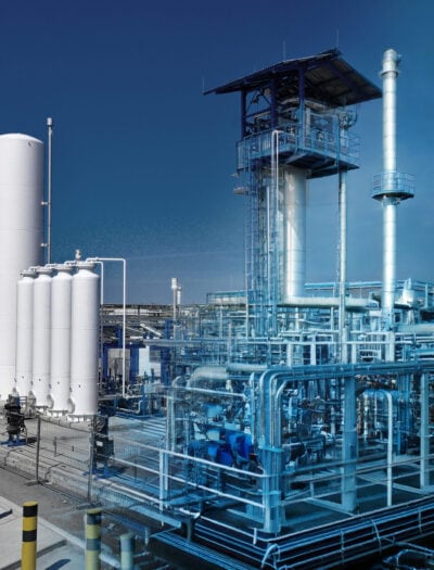 Industrial gas plant with tall white storage tanks on the left and a large processing unit on the right, shown with a blue transparent wireframe overlay highlighting the plant’s planning and engineering design.